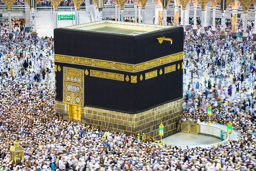 Holy Kaaba. Muslim pilgrims from all over the world. A crowd of pilgrims circumambulate. tawaf